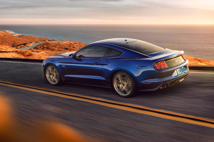 2018-Ford-Mustang-V8-GT-with-Performance-Pack-rear-three-quarter-in-motion.jpg